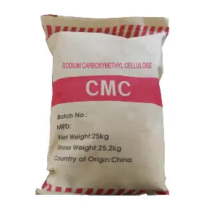 A 25kg bag of CMC (Sodium Carboxymethyl Cellulose) powder, manufactured in China. The packaging is a beige paper bag with red stripes at the top and bottom, and a prominent pink band across the middle with 'CMC' printed in white.